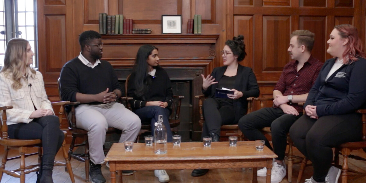 People speaking around a table talking