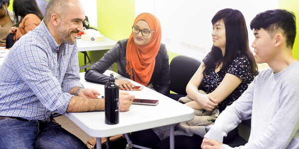 a professor with students in a seminar