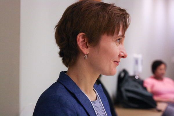 Dr. Martina Stein wearing molecular shaped earrings