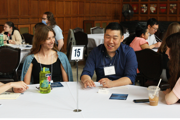 People speaking around a table talking