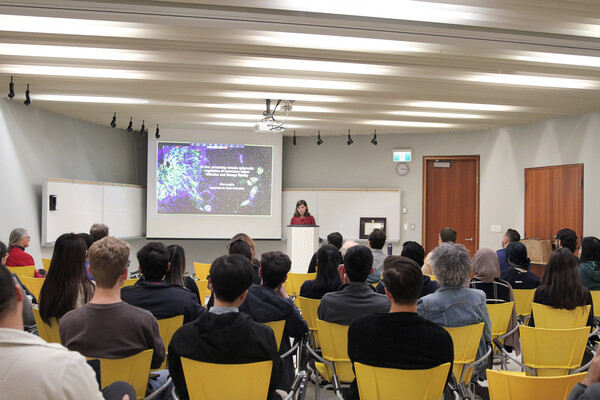 speaking to a crowd of people 