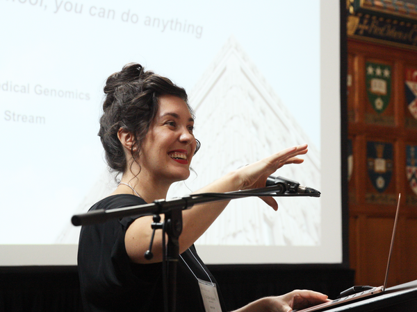 a woman enthusiastically giving a presentation